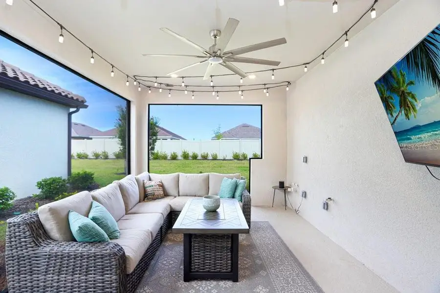 Exterior details and patio area of a home in Esplanade at Artisan Lakes, Palmetto (Image 22).