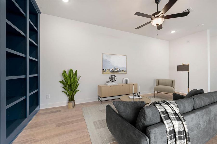 Living area featuring hardwood flooring, recessed lighting, and a ceiling fan