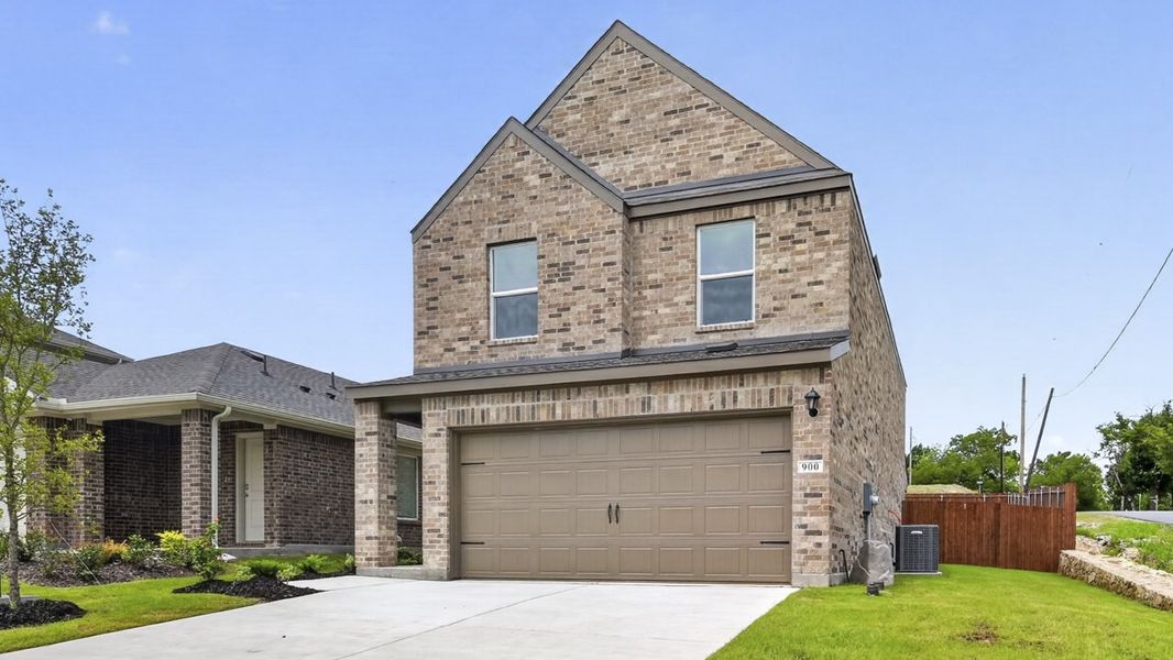 Front exterior of a new home in Hanolley Hills, Sherman, TX, highlighting curb appeal (Image 2). Front exterior of a new home in Hanolley Hills, Sherman, TX, highlighting curb appeal (Image 2).