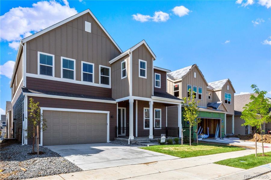 Front exterior of a new home in Dillon Pointe - Journey, Westminster, CO, highlighting curb appeal (Image 19).