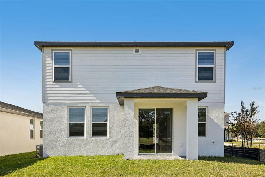 Exterior details and patio area of a home in The Reserve at Hammock Oaks - Classic Series, Lady Lake (Image 25).