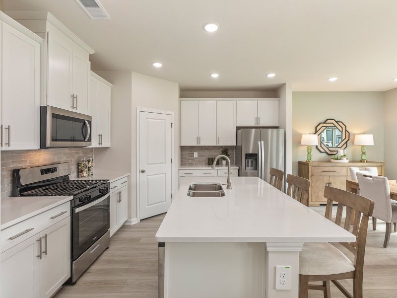 Kitchen in the Chatham floorplan at a Meritage Homes community in Angier, NC.