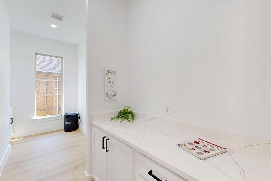 Bathroom with wood finished floors and recessed lighting