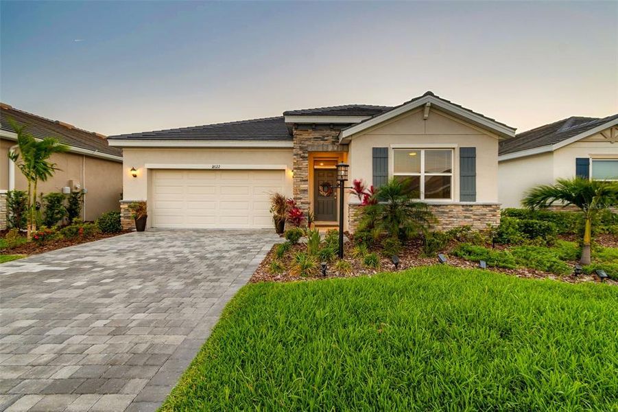 Front exterior of a new home in Star Farms at Lakewood Ranch, Bradenton, FL, highlighting curb appeal (Image 25).