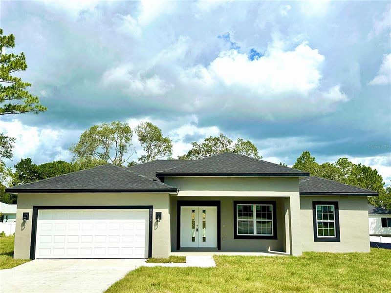 Front exterior of a new home in , Citrus Springs, FL, highlighting curb appeal (Image 16).