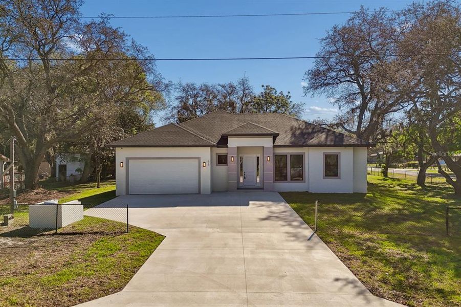 Front exterior of a new home in , Lutz, FL, highlighting curb appeal (Image 22). Front exterior of a new home in , Lutz, FL, highlighting curb appeal (Image 22).