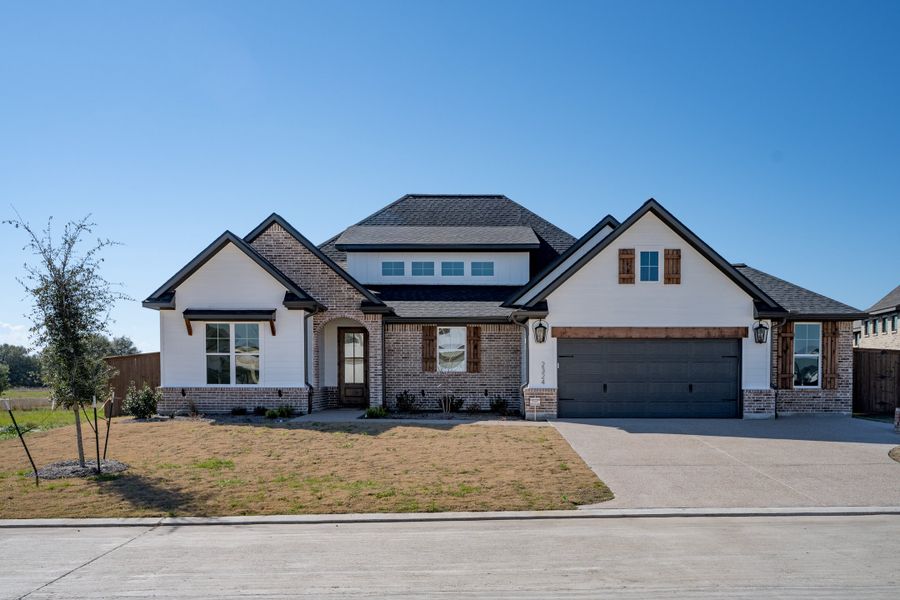 Representative exterior photo of a completed home built from the The Savannah by Reece Homes in Stella Ranch, Bryan, TX (Image 33). Representative exterior photo of a completed home built from the The Savannah by Reece Homes in Stella Ranch, Bryan, TX (Image 33).