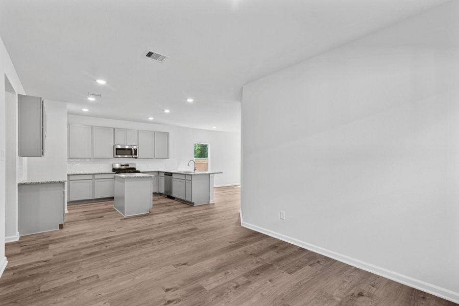 The Sparrow II- Dining into Kitchen. Sample floor plan image for illustration; upgrades, options, and colors may vary. The Sparrow II- Dining into Kitchen. Sample floor plan image for illustration; upgrades, options, and colors may vary.