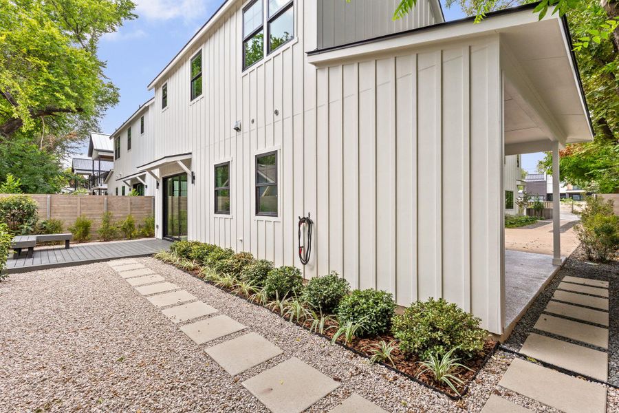 View of home's exterior featuring board and batten siding and a wooden deck View of home's exterior featuring board and batten siding and a wooden deck