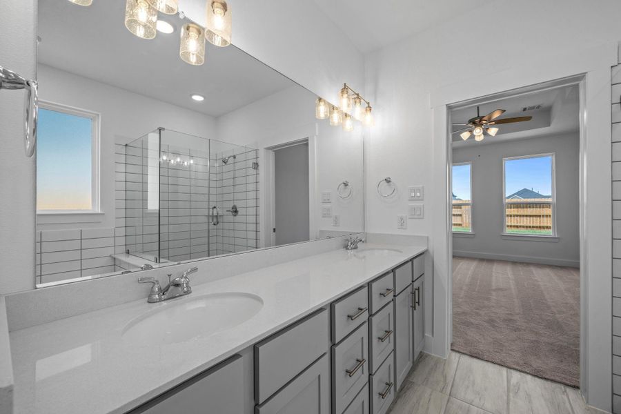 The elegant finishes, from the dazzling floors to the chic light fixtures, reflect a careful attention to detail that feels both luxurious and comforting.