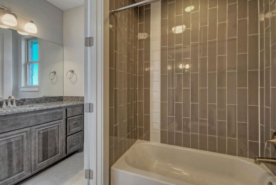 Representative furnished interior of a home built from the Madera II by Giddens Homes in Scofield Farms Estates, Georgetown (Image 161).