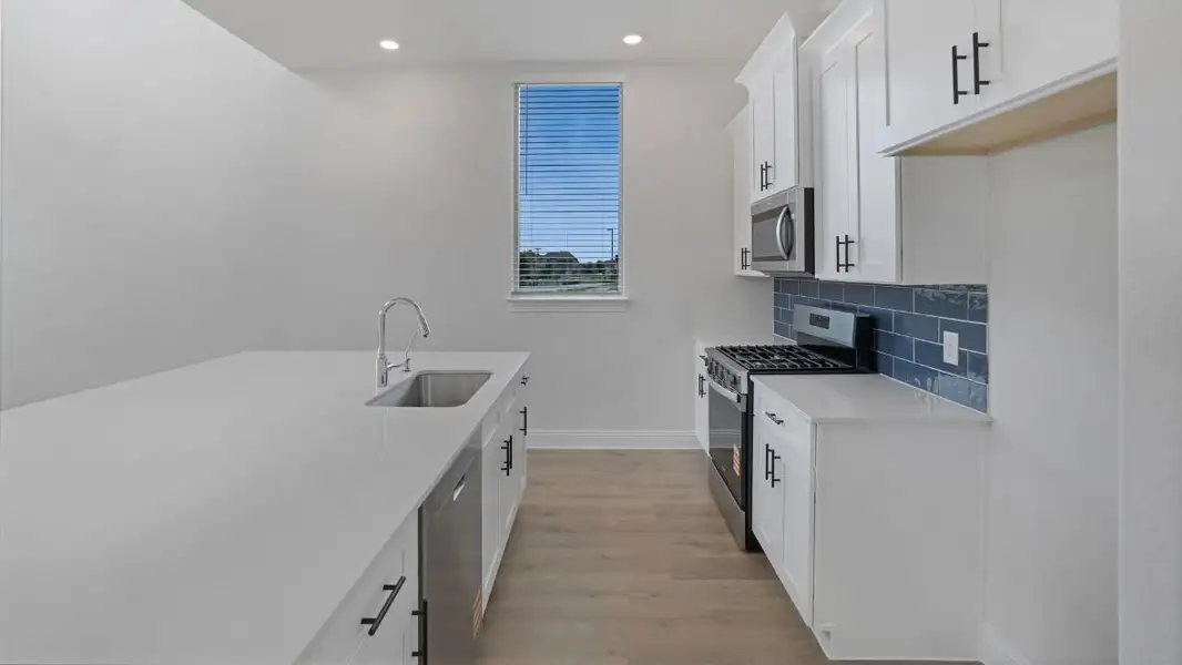 Representative furnished interior of a home built from the Appaloosa by D.R. Horton in The Avenue, Allen (Image 5).