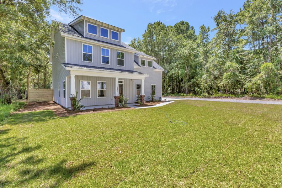Front exterior of a new home in , Awendaw, SC, highlighting curb appeal (Image 13). Front exterior of a new home in , Awendaw, SC, highlighting curb appeal (Image 13).
