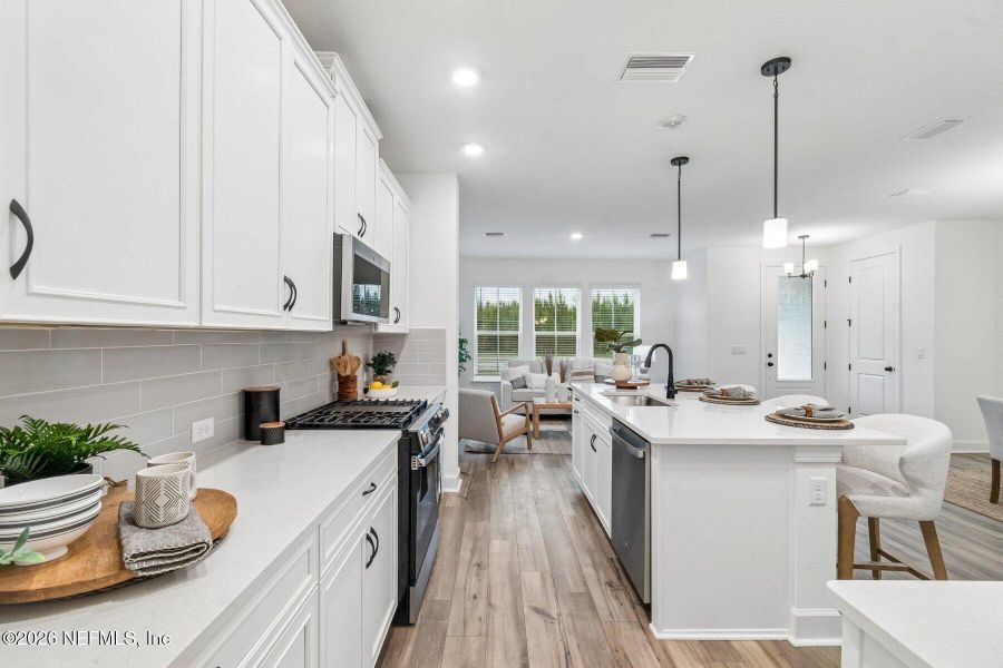 Furnished interior view inside a new home in Westerly Park at Wildlight - Courtyard Collection, Yulee (Image 5).
