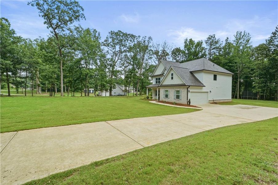 Front exterior of a new home in , McDonough, GA, highlighting curb appeal (Image 27).