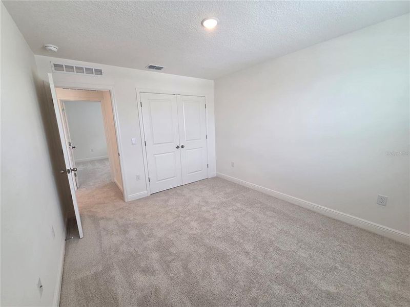 Spacious, unfurnished interior of a new home in Villamar, Winter Haven (Image 33).