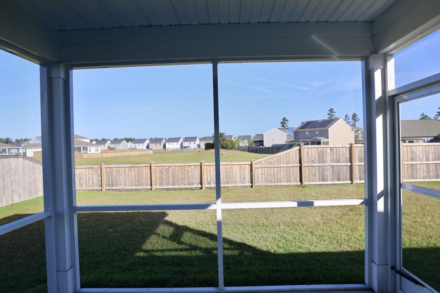 Exterior details and patio area of a home in Sanctuary Cove at Cane Bay, Summerville (Image 4).