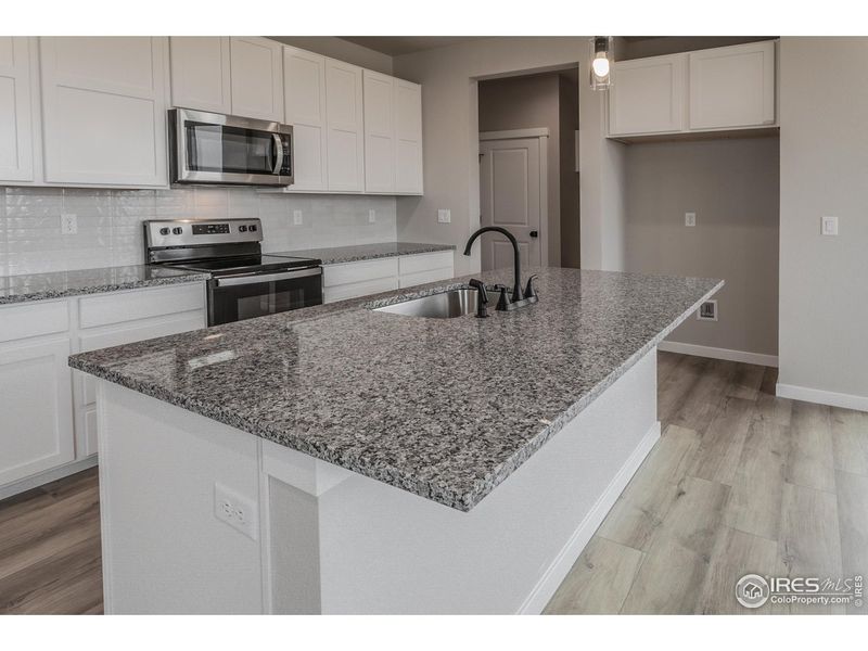 Furnished interior view inside a new home in Promontory Point, Greeley (Image 6).