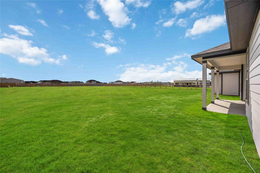 Exterior details and patio area of a home in Blue Jay's Landing, Needville (Image 3).