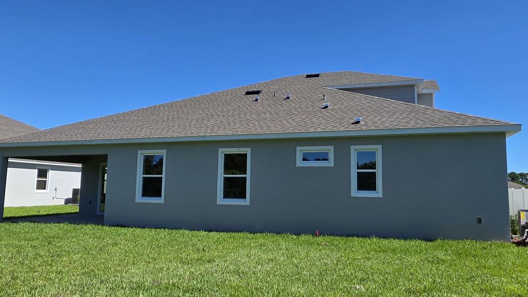Exterior details and patio area of a home in Island Forest Preserve, Merritt Island (Image 2).