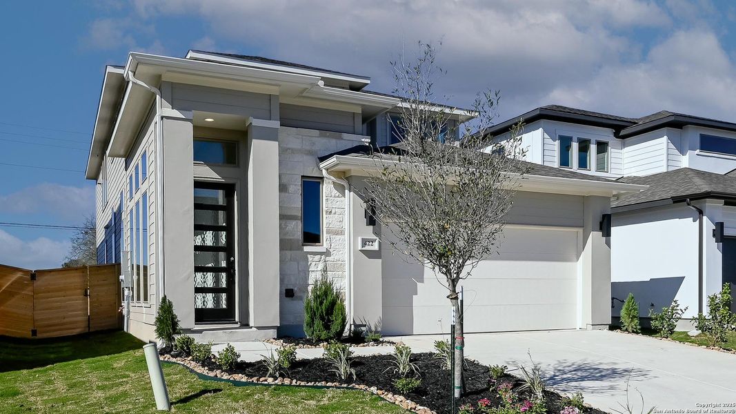 Front exterior of a new home in Solms Landing 45', New Braunfels, TX, highlighting curb appeal (Image 20).