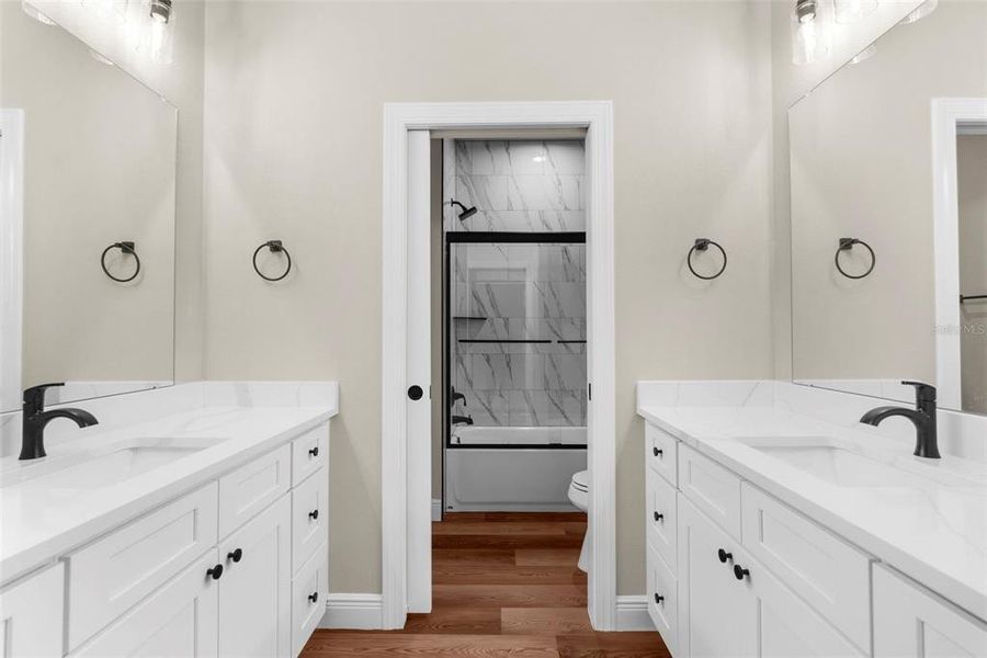 Second full bathroom with dual vanities and sinks...and separate toilet shower room!! GREAT DESIGN!!!