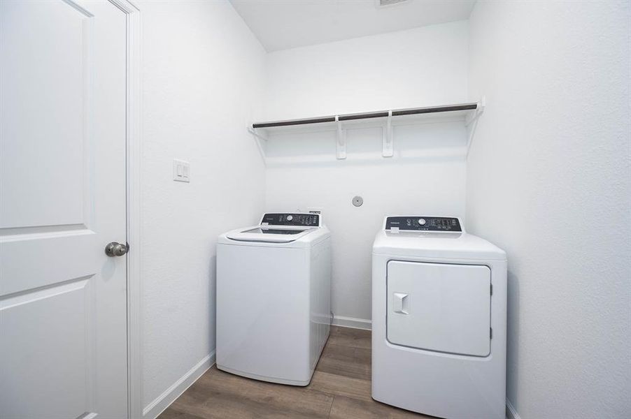 Washer and dryer included! Simplify your routine with this spacious laundry room, complete with washer and dryer connections and a built-in shelf for extra storage.