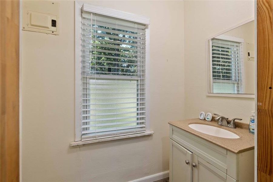 Bathroom featuring healthy amount of natural light and vanity Bathroom featuring healthy amount of natural light and vanity