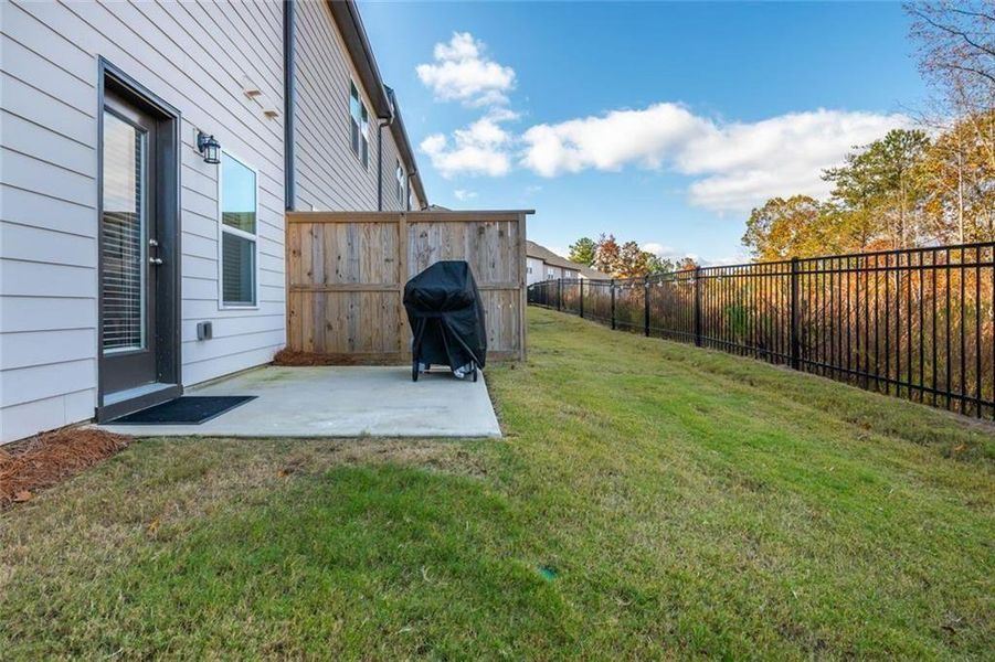 Exterior details and patio area of a home in Avignon - Townhomes, Cumming (Image 4). Exterior details and patio area of a home in Avignon - Townhomes, Cumming (Image 4).