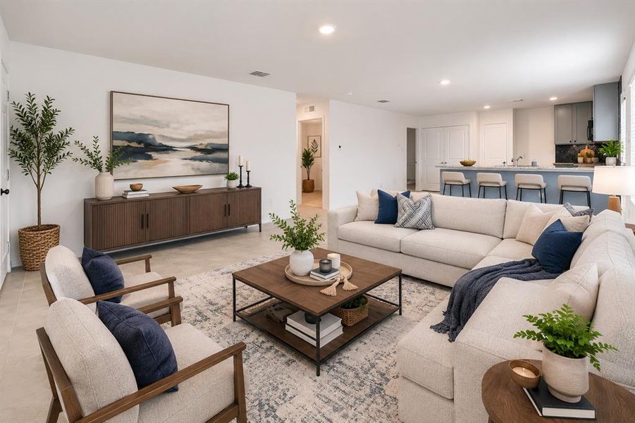 Virtual staging Open-concept living area featuring light-toned tile flooring and recessed lighting