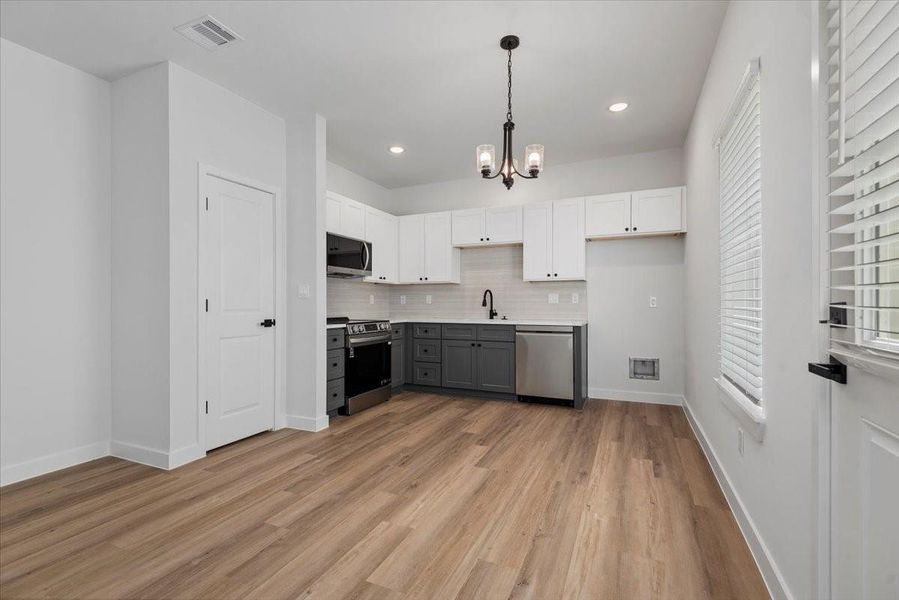 Another angle of the open-concept layout Another angle of the open-concept layout