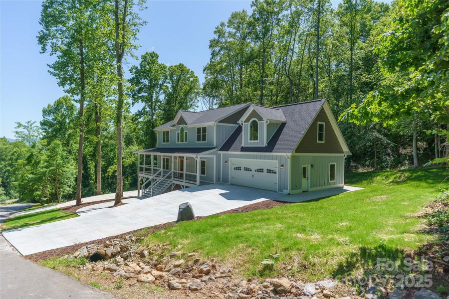 Sunny, welcoming curb appeal. Top of garage has zero entry to main level