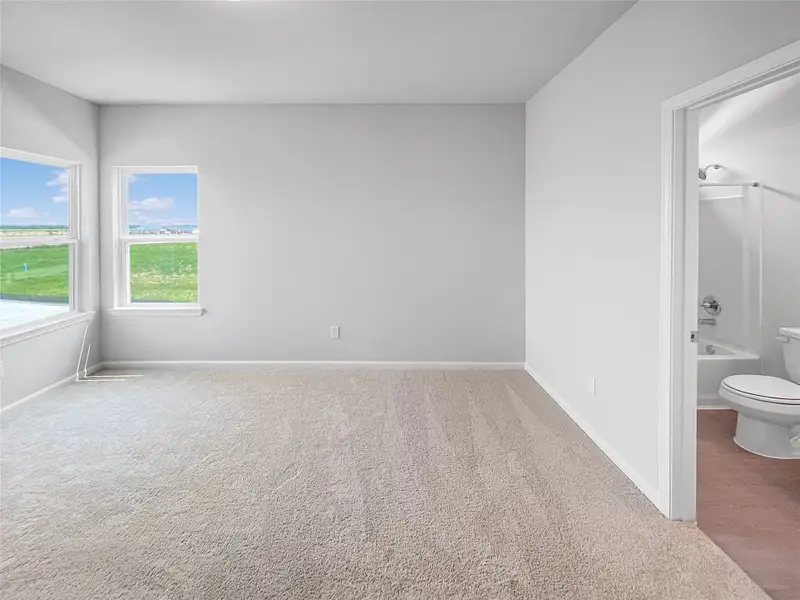 The Waring III- Upstairs Bedroom with En Suite. Sample image for illustration; upgrades, options, and colors may vary.