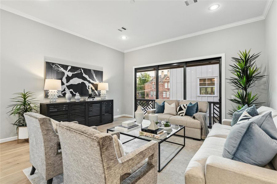 Elevated living space with a full sliding balcony door - offering tons of natural light