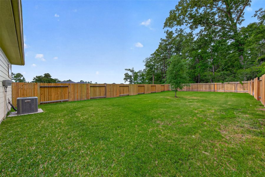 Exterior details and patio area of a home in , Huffman (Image 21).