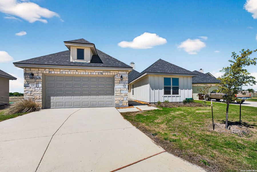 Front exterior of a new home in Boehme Ranch, Castroville, TX, highlighting curb appeal (Image 26).