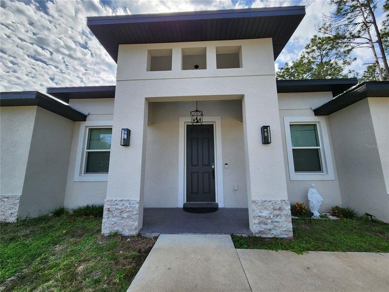 Exterior details and patio area of a home in , Ocala (Image 41).