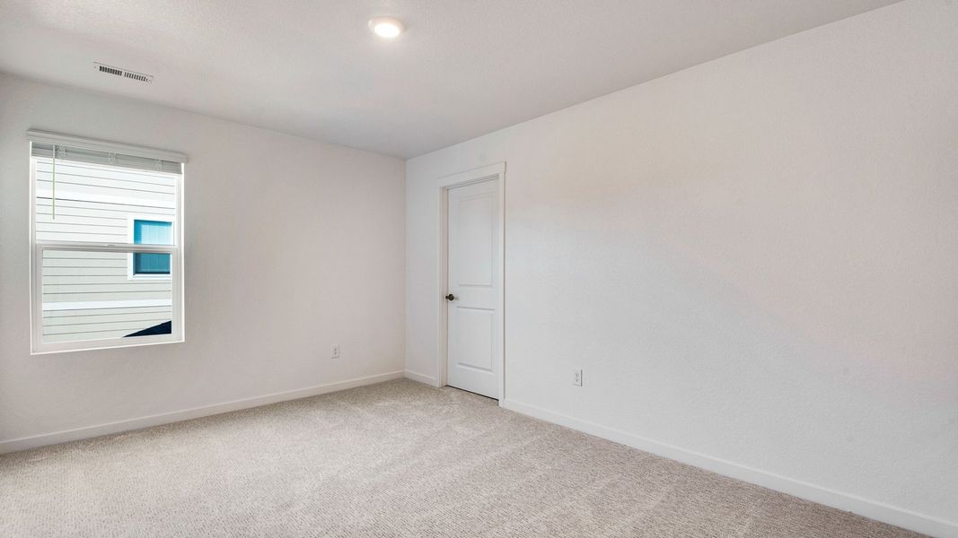 Spacious, unfurnished interior of a new home in Trails at Crowfoot, Parker (Image 23).