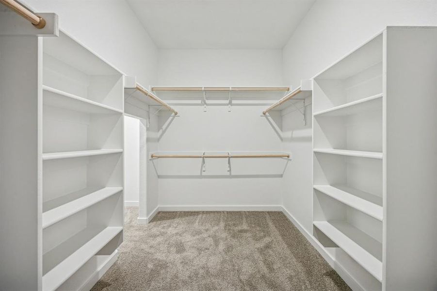 Primary Closet in the Wimbledon home plan by Trophy Signature Homes – REPRESENTATIVE PHOTO Primary Closet in the Wimbledon home plan by Trophy Signature Homes – REPRESENTATIVE PHOTO