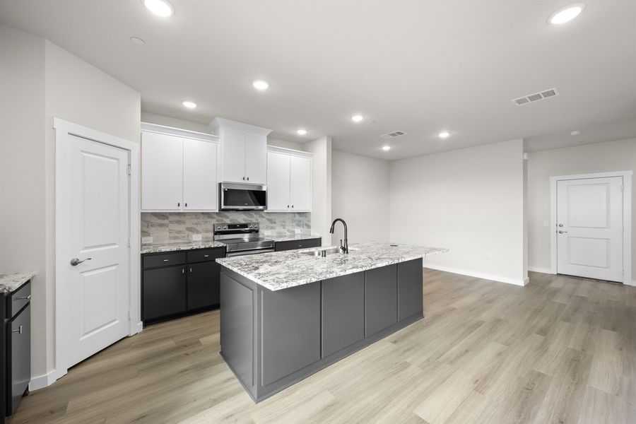 Furnished interior view inside a new home in Wildridge, Oak Point (Image 7).