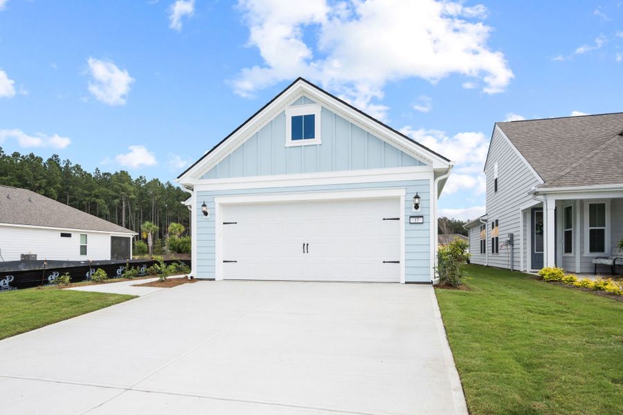 Front exterior of a new home in Del Webb Savannah at Heartwood, Richmond Hill, GA, highlighting curb appeal (Image 27). Front exterior of a new home in Del Webb Savannah at Heartwood, Richmond Hill, GA, highlighting curb appeal (Image 27).