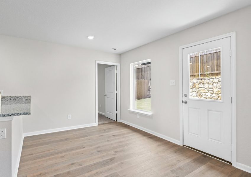 The dining room sits adjacent to the kitchen. The dining room sits adjacent to the kitchen.