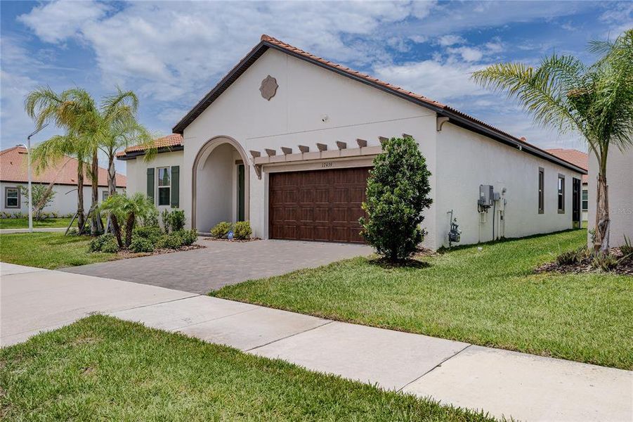 Front exterior of a new home in Southshore Bay Active Adult, Wimauma, FL, highlighting curb appeal (Image 22).