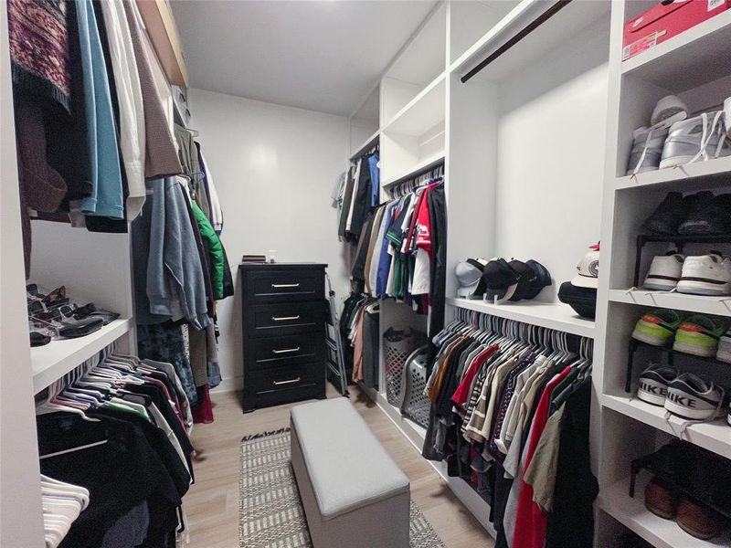 Spacious closet featuring light wood finished floors