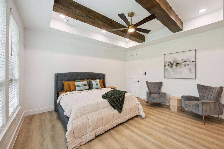Primary Bedroom on 1st floor. Stunning tray ceilings with wood beam accents. Primary Bedroom on 1st floor. Stunning tray ceilings with wood beam accents.