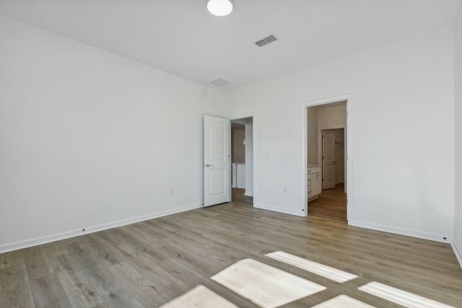 Representative unfurnished interior of a home built from the Macon by Ashton Woods in Rowland's Grant, Fuquay Varina (Image 36).