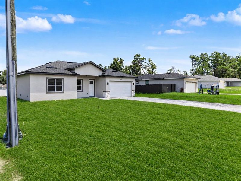 Front exterior of a new home in , Ocala, FL, highlighting curb appeal (Image 23).