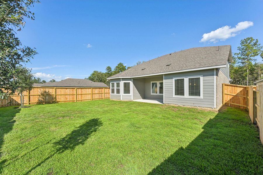 Front exterior of a new home in Stewart's Ranch, Conroe, TX, highlighting curb appeal (Image 1). Front exterior of a new home in Stewart's Ranch, Conroe, TX, highlighting curb appeal (Image 1).
