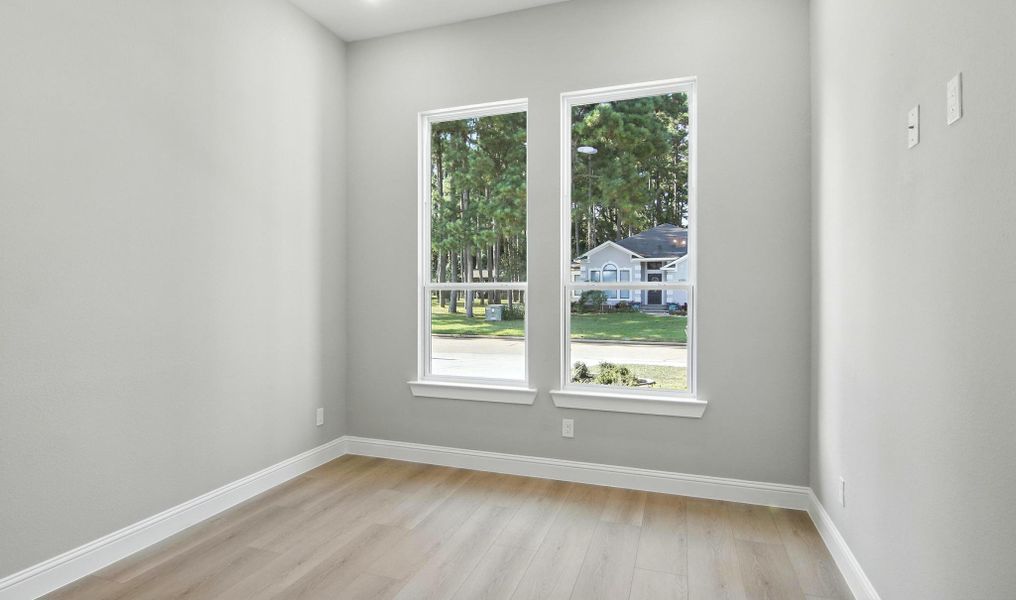 This light-filled room offers endless possibilities — ideal as a guest bedroom, nursery, or home office. The large double windows bring in beautiful natural light and offer peaceful neighborhood views, while the neutral wall color and wide-plank flooring create a warm and welcoming feel. With its open layout and modern finishes, this space provides the perfect blank canvas to fit your lifestyle needs. This light-filled room offers endless possibilities — ideal as a guest bedroom, nursery, or home office. The large double windows bring in beautiful natural light and offer peaceful neighborhood views, while the neutral wall color and wide-plank flooring create a warm and welcoming feel. With its open layout and modern finishes, this space provides the perfect blank canvas to fit your lifestyle needs.