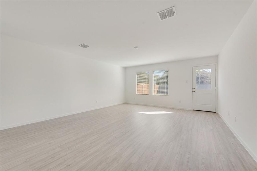 Empty room featuring light wood-type flooring